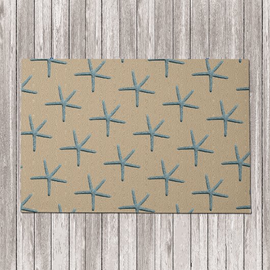 砂の背景に青い指のヒトデ ドアマット