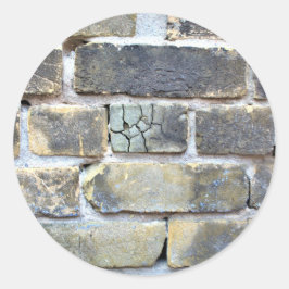 砕けた砕けた薄い灰色のレンガの壁 ラウンドシール