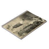 神社で十字のイエス・キリストに祈っている小さい男の子 ノートブック (左側)