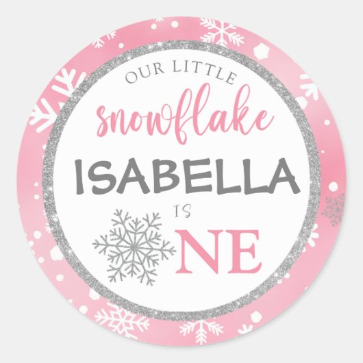 私たちの小さなスノーフレークのピンクの1歳の誕生日 ラウンドシール (正面)