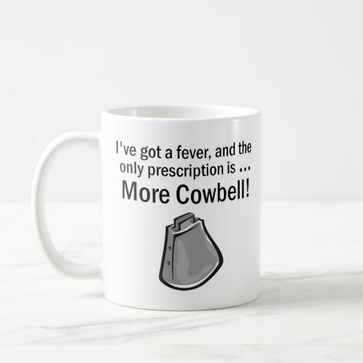 私により多くのカウベルがあるために得ました コーヒーマグカップ (左)