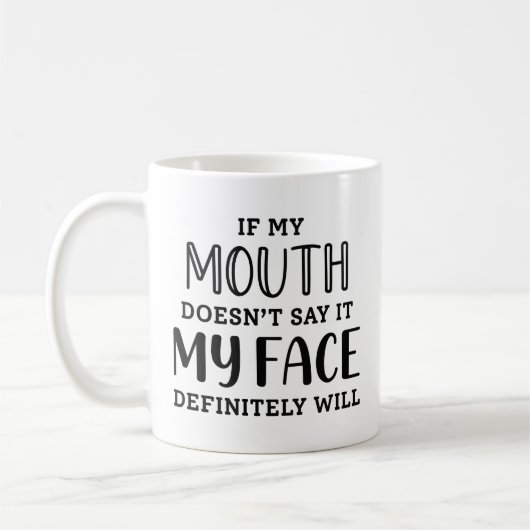 私のもし口は絶対に私の顔が言わない コーヒーマグカップ (左)