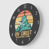 私の立つ無地の岩キリスト ラージ壁時計 (傾斜)