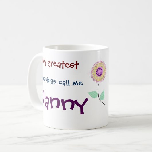 私の素晴らし恵みは私をナニーコーヒーマグと呼ぶ コーヒーマグカップ (正面左)