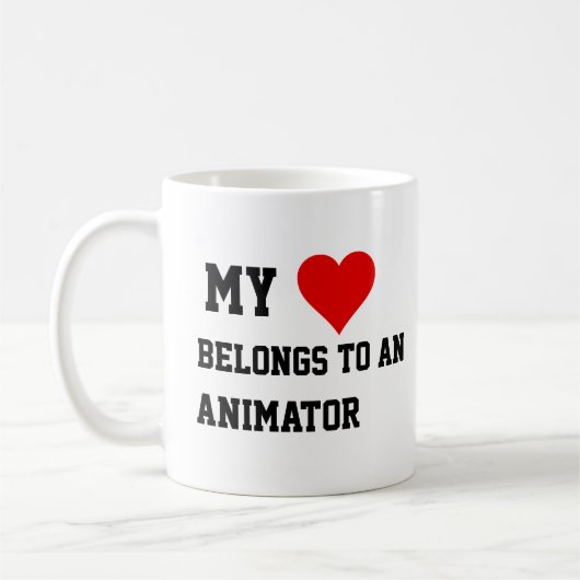 私はアニメーターマグに所属している コーヒーマグカップ (左)