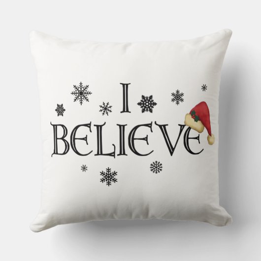 私はクリスマスの枕雪片及びサンタの帽子を信じます クッション (裏面)