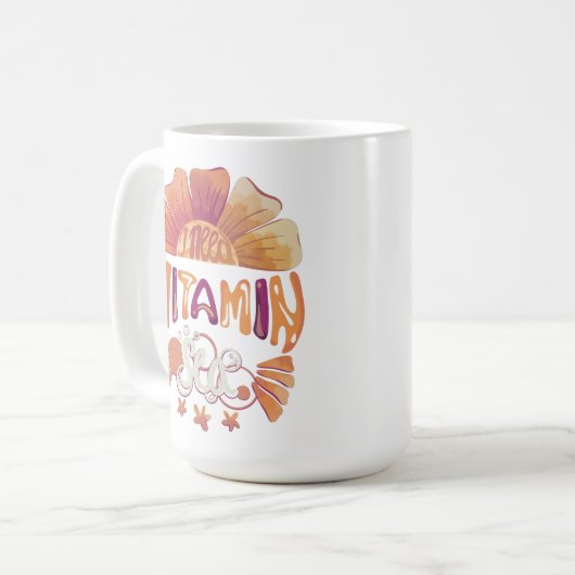 私はビタミンの海が必要だ:手で文字を入れたサンセットエスケープ コーヒーマグカップ (正面左)