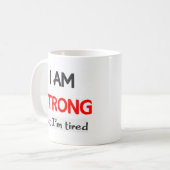 私は強いが疲れている コーヒーマグカップ (正面左)