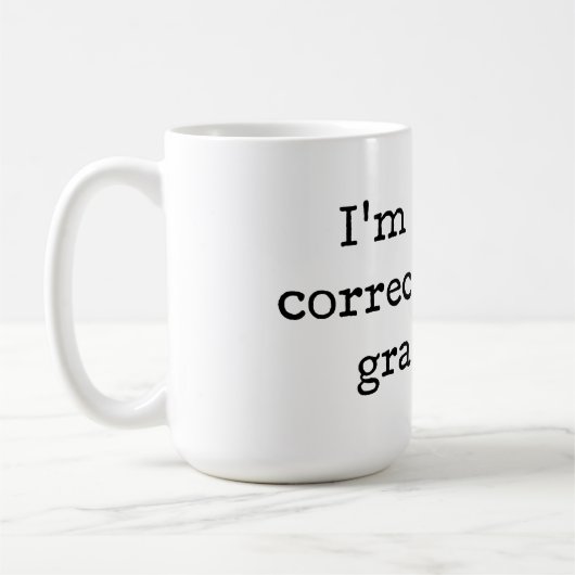 私は無言であなたの文法を訂正しています コーヒーマグカップ (左)
