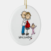 私達は幼児の女の子のオーナメントが付いているカップルを期待しています セラミックオーナメント (右)