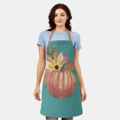 秋のカボチャフローラテラコッタオレンジとティール(緑がかった色) エプロン (着用した状態)