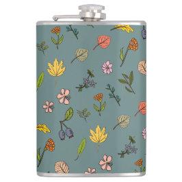 秋のピンク色の黄色い花と葉緑色 フラスク