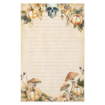 秋の庭にスカルとカボチャが並ぶ