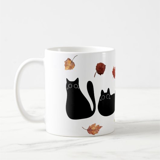 秋の葉と遊ぶ猫の線画アート コーヒーマグカップ (左)