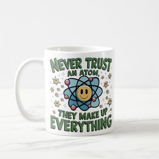 科学おもしろいユーモアTシャツ – "Never Trust an Atom コーヒーマグカップ (左)