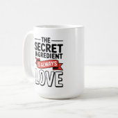「秘密の成分はいつも愛である コーヒーマグカップ (正面左)