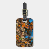 移動する(昆虫)オオカバマダラ、モナーク蝶が葉付着する ラゲッジタグ (正面縦)