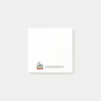 積み重ねた本のメモのティーカップ ポストイット