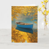 穏やかな湖に浮かぶ青いボート カード (黄色い花)