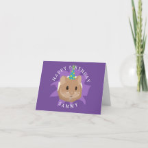 穴から顔を出すかわいい誕生日ハムスター