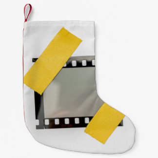 空の35mmフィルムフレーム、黄色のストリップ。 スモールクリスマスストッキング