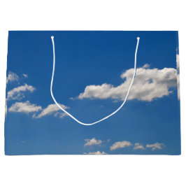 空は青、白い雲が通り過ぎている ラージペーパーバッグ