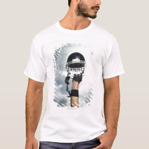 空気のヘルメットを握っているフットボール選手 Tシャツ