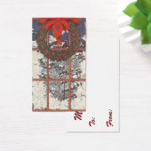 窓に飾られた雪の降るクリスマスのリース (デスク)