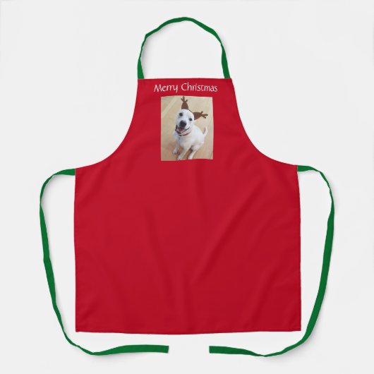 笑顔の白トナカイ子犬クリスマスレッド エプロン (正面)