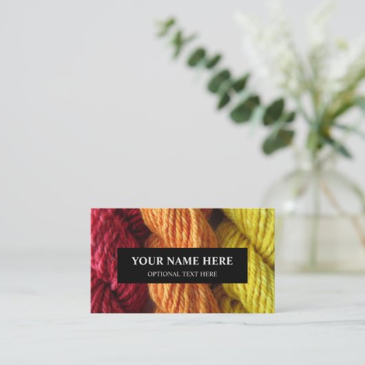 糸の編み物手紡ぎで赤橙黄色の写真 名刺 (スタンド正面)