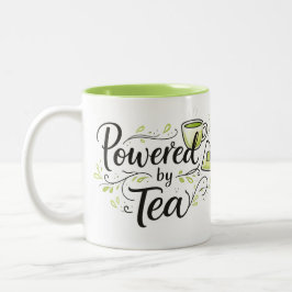 紅茶に支えられたキュートなティーカップと紅茶パックのイラスト ツートーンマグカップ