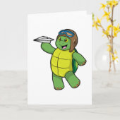 紙飛行機のパイロットとしてのアカウミガメ カード (黄色い花)