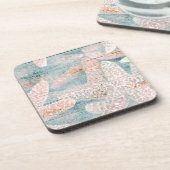 素朴なヒトデのティール（緑がかった色）の青 コースター (左側)