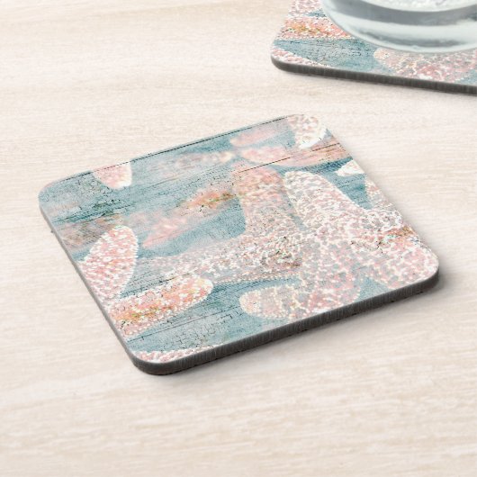 素朴なヒトデのティール（緑がかった色）の青 コースター (左側)