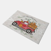 素朴なヴィンテージの赤いトラックのカボチャ姓 ドアマット (アングル)