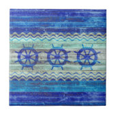 素朴な濃紺の沿岸装飾の船の車輪 タイル (正面)