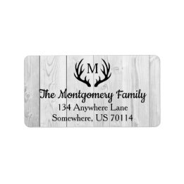 素朴な農家の黒のシカの(雄ジカの)枝角及び白い木 ラベル