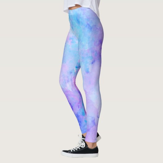 紫とターコイズの水色のスプラッシュ レギンス (左)