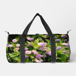 紫と白の花 ダッフルバッグ