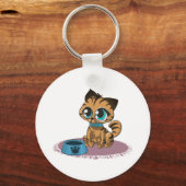 紫のマットに茶色の青い目の子猫 キーホルダー (正面)