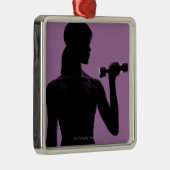 紫色の背景の女の子の持ち上がるダンベル メタルオーナメント (右)