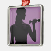 紫色の背景の女の子の持ち上がるダンベル メタルオーナメント (左)