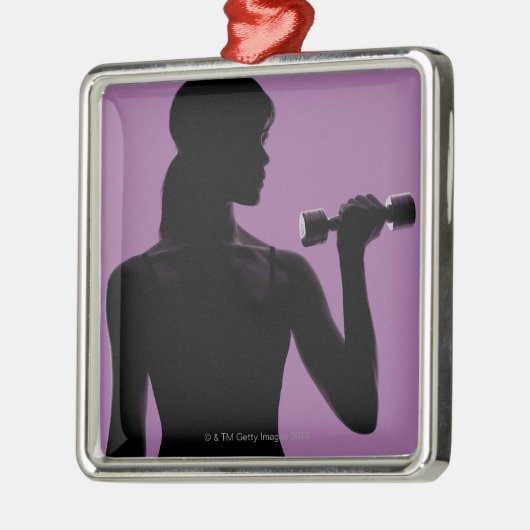 紫色の背景の女の子の持ち上がるダンベル メタルオーナメント (左)