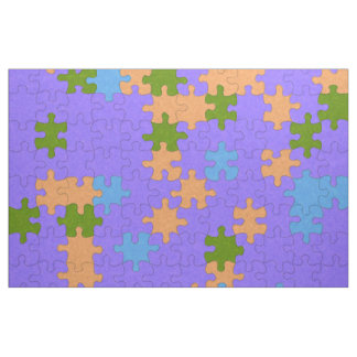 紫、緑、オレンジ、青のパズル パターン(の模様が)ある ファブリック
