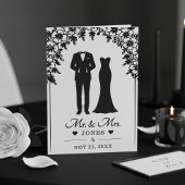 結婚式の新郎新婦 ウェディングドレス タキシード 花のアーチの写真 プログラム