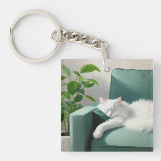 絵を描グリーンのソファで寝る猫 キーホルダー (正面)