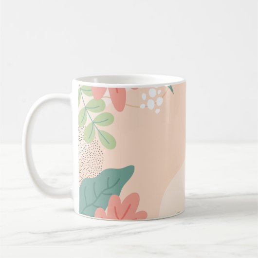 緑とはっきりしたオレンジ色の色合いの葉グラフィック コーヒーマグカップ (左)