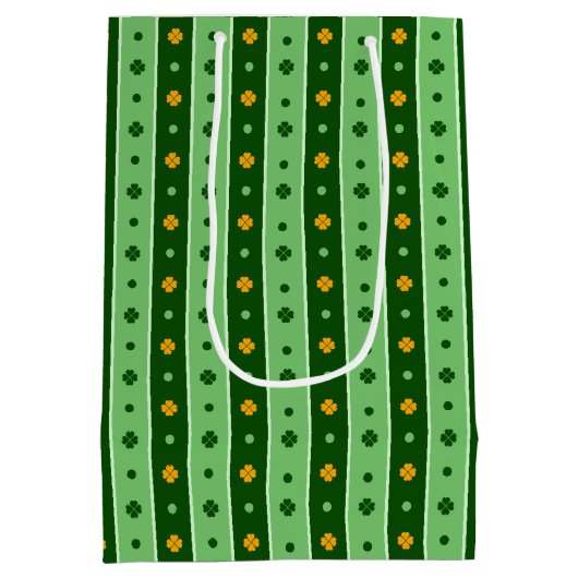 緑とオレンジのアイルランドのシャムロックの列 ミディアムペーパーバッグ (裏面)