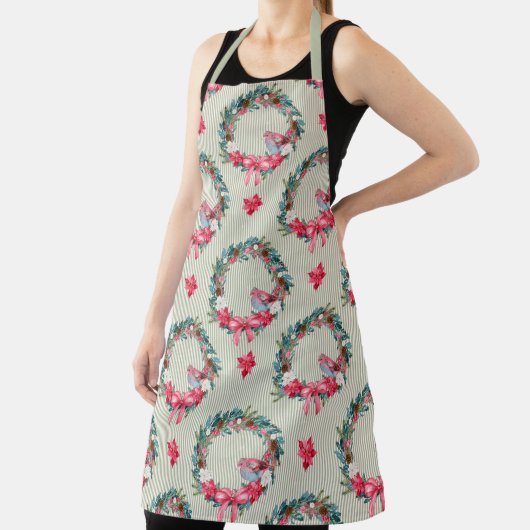 緑とピンクのクリスマスリースと（鳥）ショウジョウコウカンチョウ エプロン (インサイチュ)