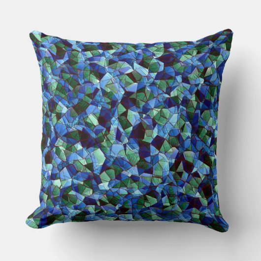 緑と青の不規則なモザイクが重ねられた乱雑な クッション (正面)